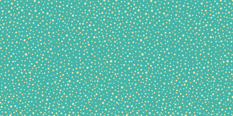 Seamless pattern with golden polka dots on turquoise background.