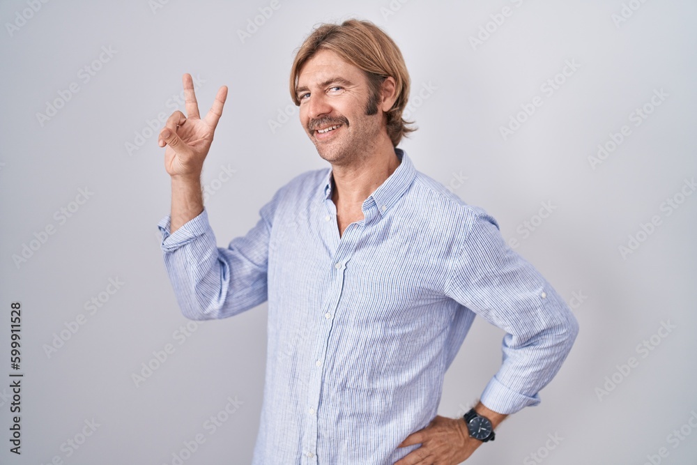 Canvas Prints caucasian man with mustache standing over white background smiling looking to the camera showing fin