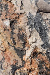 natural weathered red brown and black rock texture abstract background