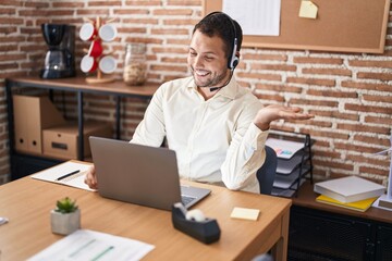 Young man call center agent having video call at office