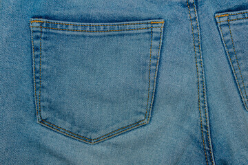 Jeans texture with pocket. Close-up of blue jeans.