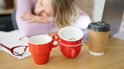 Young blonde woman business worker tired sleeping at office