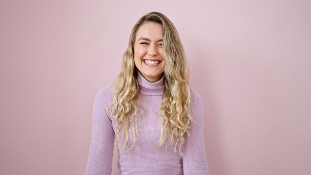 Young Blonde Woman Smiling Confident Standing Over Isolated Pink Background