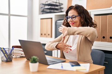 Middle age hispanic woman doing video call using sign language at the office © Krakenimages.com