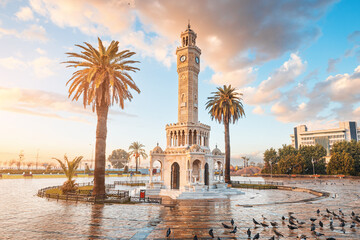 Izmir, located on the Aegean coast of Turkey, is a vibrant city with many landmarks, one of which is the clocktower in Konak Square. - obrazy, fototapety, plakaty