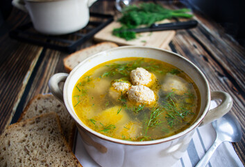 Soup close-up. Soup with meatballs. On a wooden background.