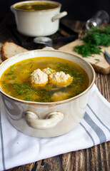 Soup close-up. Soup with meatballs. On a wooden background.