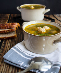 Soup close-up. Soup with meatballs. On a wooden background.