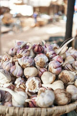  Delicious group of garlic on wicker bowl at street market