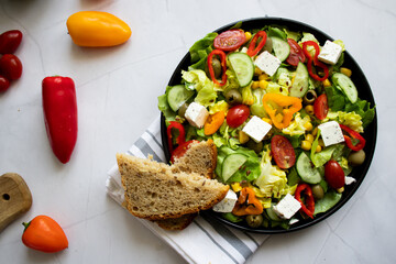 A green vegan salad made from a mix of green leaves and vegetables. white background