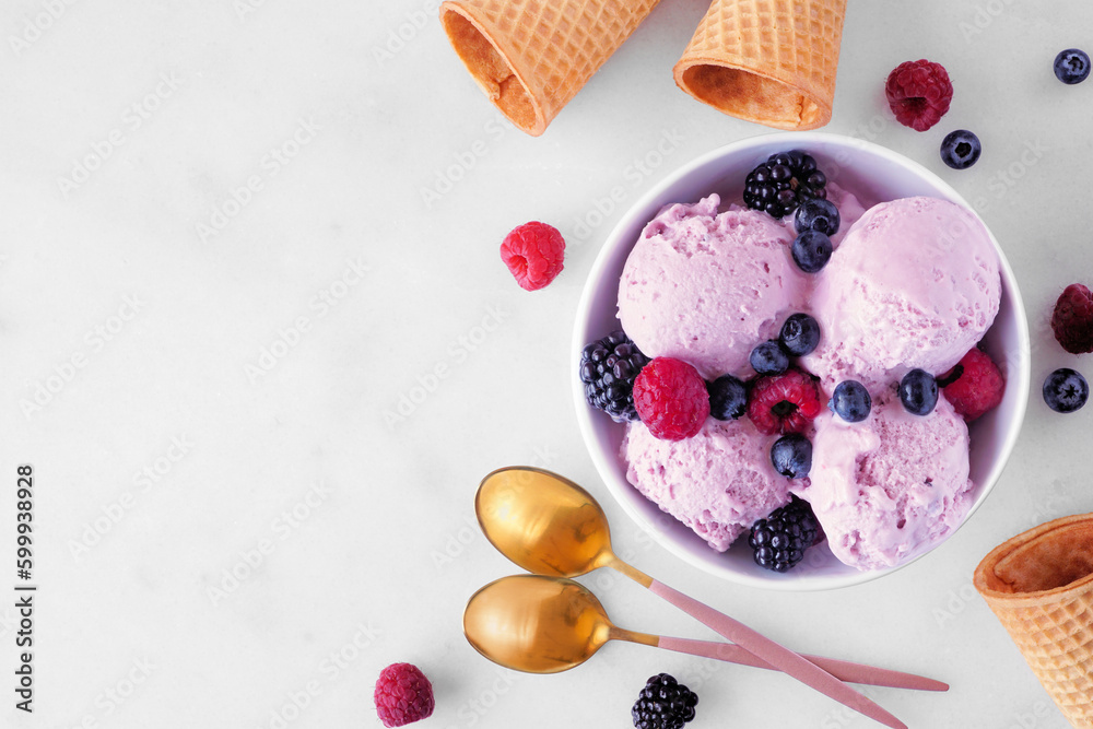 Poster bowl of field berry ice cream. top view table scene with copy space over a white marble background.