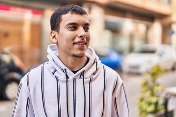 Young man smiling confident standing at street