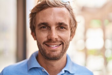 Young man smiling confident standing at street