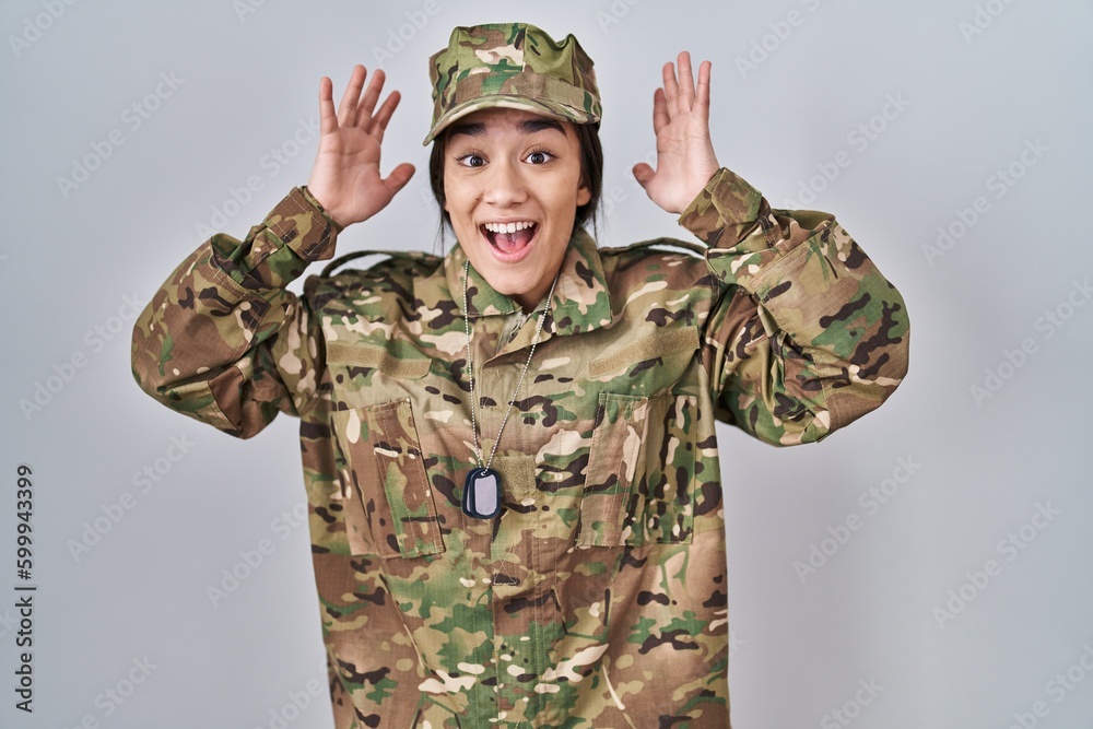 Canvas Prints young south asian woman wearing camouflage army uniform celebrating crazy and amazed for success wit