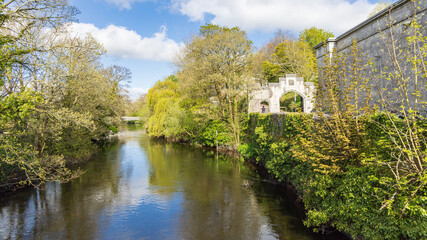 River Lee surrounded by grene bushes and trees along University Colleg Cork in Cork Munster province in Ireland Europe