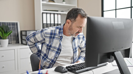 Middle age man business worker suffering for backache working at office