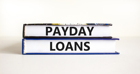 Payday loans symbol. Concept words Payday loans on beautiful books. Beautiful white table white background. Business and Payday loans concept. Copy space.