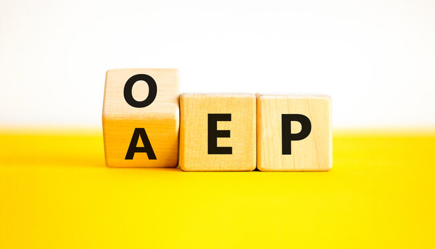 AEP or OEP symbol. Concept words AEP annual enrollment period OEP open enrollment period. Beautiful yellow table white background. Medical annual or open enrollment period concept. Copy space.