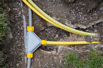 underground connection of three lines of cables electric infrastructure installation. Construction...