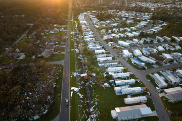 Destroyed by hurricane Ian suburban houses in Florida mobile home residential area. Consequences of...