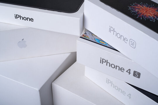 Prague, CZ - 24 April 2023: Loyal customer concept. Various of devices. Diferent generations of Brand Apple in box. Storage iPhone, MacBook. Illustrative Editorial