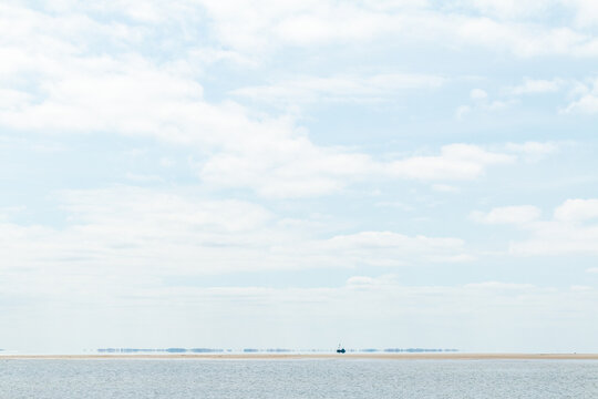 A ship far a way from the the beach