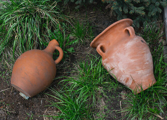 Vintage, vintage clay pots are piled on top of each other. Collection of baked clay tableware....
