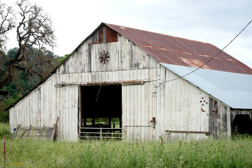 Old White wooden Barn with tin roof