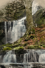 Digital watercolour landscape painting of waterfall in Yokrshire Dales in England during Winter