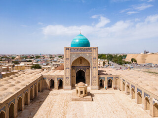 Buhara, Uzbekistan Aerial view of Poi Kalan Mosque and citadele Ark of Bukhara - obrazy, fototapety, plakaty
