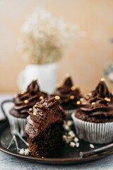 Delicious homemade chocolate cupcakes on nicely decorated  table. Sweet food concept.