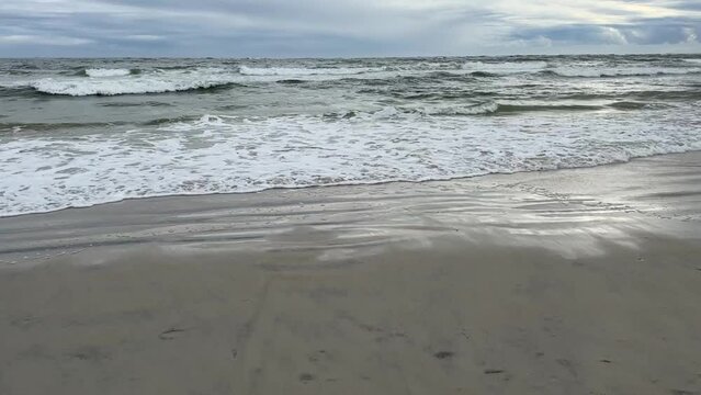 Waves of the Atlantic Ocean on an overcast, gray day in Vilano Beach Florida