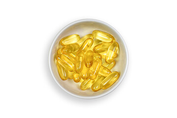 Clipping path. Gold fish oil gel Capsules in bowl isolated. Vitamin E. Supplementary food. Capsules salmon fish oil on Top view(Flat lay) view. Omega 3.