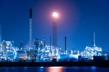 View of the plant at night. Industrial landscape. Production. Heavy industry. Processing of oil and gas.  Industrial area in the evening.