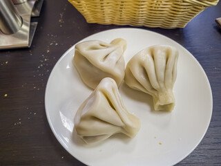 Cooked khinkali traditional georgian dish isolated on white background. Georgian traditional cuisine.