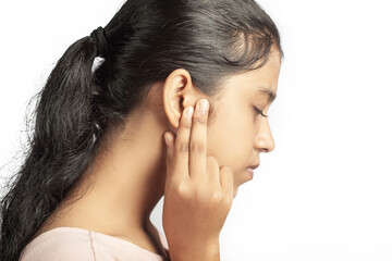 side view of an indian women having earache in white background