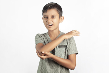 close up of indian child suffering from pain in hand or elbow