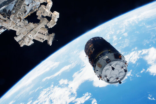 Docking spacecraft in outer space. Elements of this image furnished NASA.