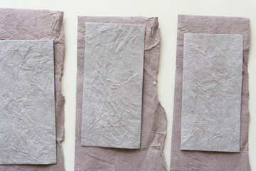 paper cards with crushed fabric-like texture on blank paper