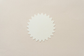 isolated light yellow stylized or abstract representation of a flower or floral emblem or badge...