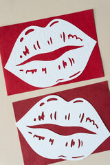 oversized lips that have been machine-cut from scrapbook paper
