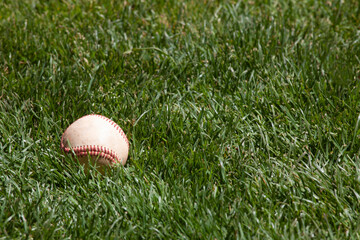 Baseball on a grassy field, background textures