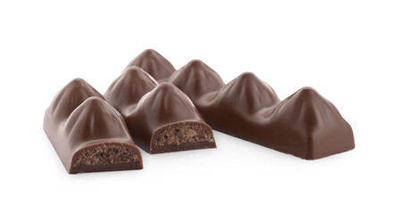 Pieces of tasty chocolate bars on white background