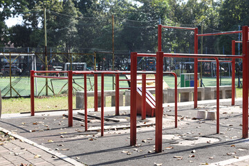 Fototapeta na wymiar Urban sports ground with exercise equipment for sports at public area. Empty sports ground outdoor workout in a park.