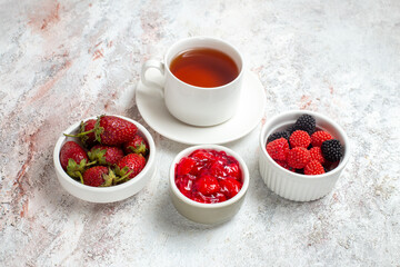 front view cup of tea with confitures and jam on white background fruit jam jelly