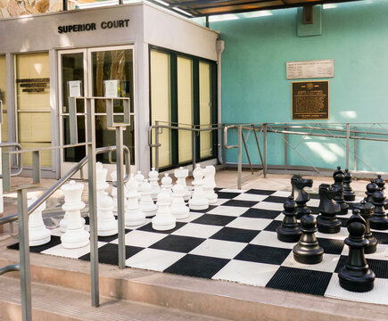 Avalon, Catalina Island, California - USA: Giant black and white chess set outside the Los Angeles County Superior Court, Avalon, Catalina Island. vacation, tourist, lifestyle, city, scene, 