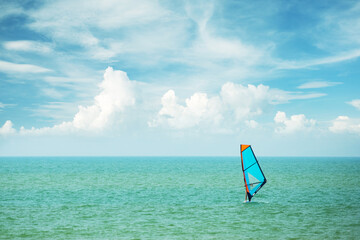  windsurfing in the ocean waves.  summer fun adventure. hobby.