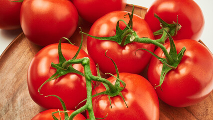 tomatoes on a wooden plate