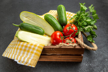 front view fresh vegetables tomatoes cucumbers squashes and greens on grey background meal salad ripe vegetable