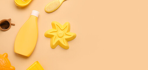 Sunscreen cream and beach accessories for child on beige background with space for text
